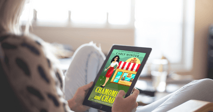 woman reading chamomile and chaos on an ereader by carly winter