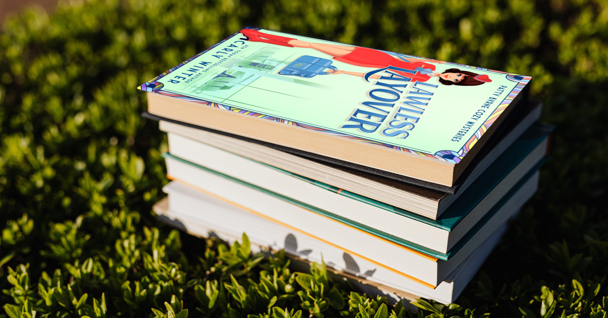 Lawless Layover by carly winter sitting on top of a tbr pile historical cozy mystery